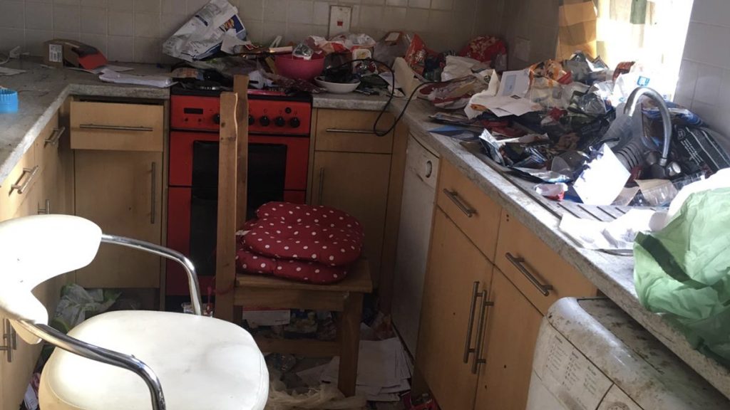 Cluttered kitchen of a 3-bed mid-terrace in Barnsley (S71) needing full refurbishment, bought by Property Rescue